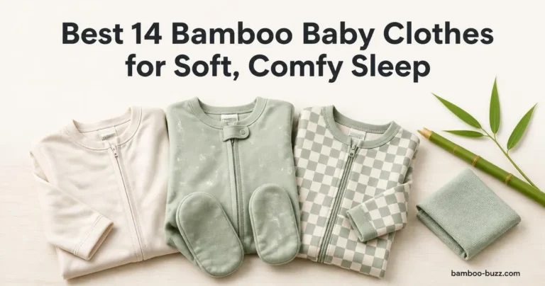 best bamboo baby clothes: three folded infant bamboo pajamas (two footies, one silky) on light wood with bamboo stalk and leaf