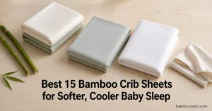 best bamboo crib sheets: three folded bamboo crib sheets (2-pack, luxury, cooling) flatlay with bamboo stalk and leaf on light wood surface