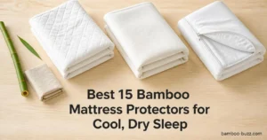 best bamboo mattress protector: three folded white protectors and a partially zipped encasement, bamboo stalk on light wood.